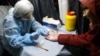 Russia -- A man has a blood test at a mobile HIV testing unit near Uralmash Station of the Yekaterinburg Metro, November 2, 2016